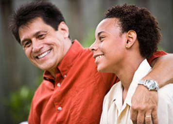 Father and son smiling